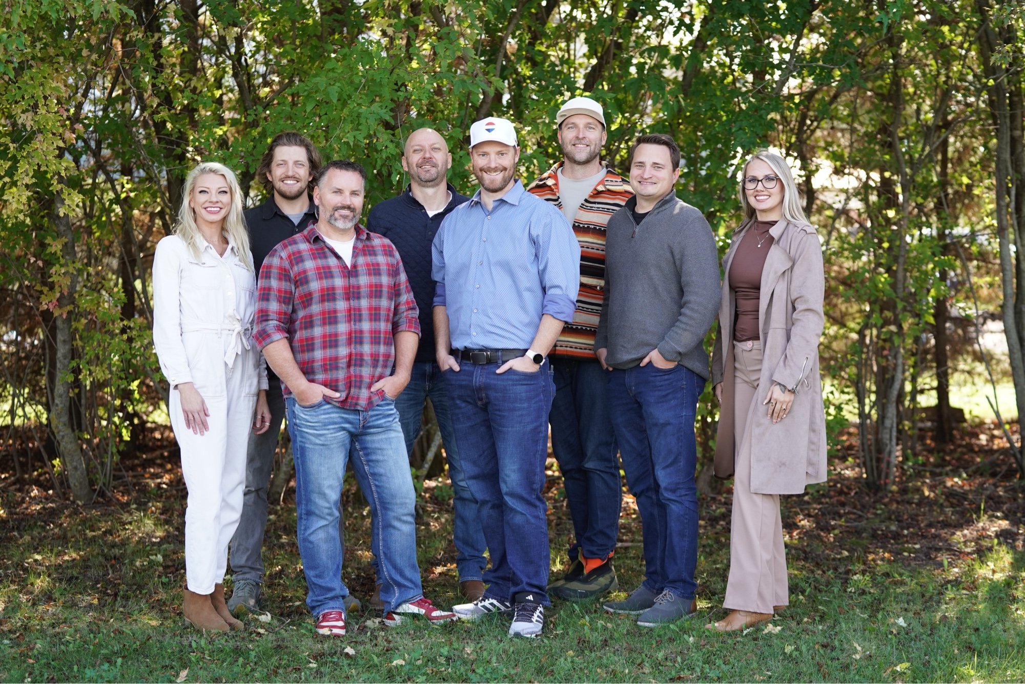 The Brozville Group team standing together outdoors